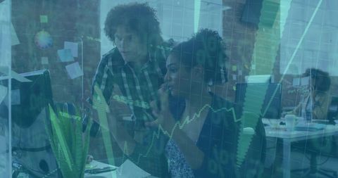 Colleagues Collaborating on Digital Data Visualization in Modern Office