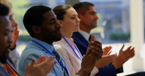 Diverse Business Professionals Applauding Presentation