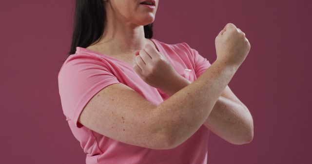 Woman Practicing Self-Defense Techniques Against Pink Background - Download Free Stock Images Pikwizard.com