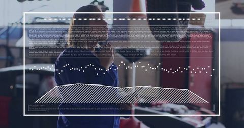 Mechanic Analyzing Car Data with Mobile Device in Modern Workshop