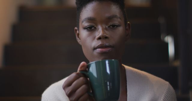 Young Woman Enjoying Coffee Mug Relaxing Indoors - Download Free Stock Images Pikwizard.com