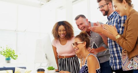 Diverse Team Celebrates Success in Bright Office - Download Free Stock Images Pikwizard.com