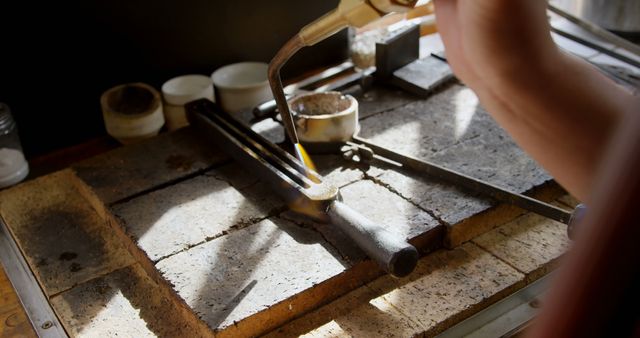 Craftsperson Melting Metal in Workshop Studio with Torch - Download Free Stock Images Pikwizard.com