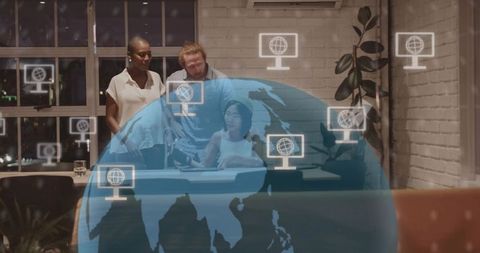 Multicultural team collaborating over tablet with digital globe overlay in modern office