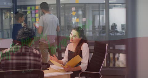 Collaborative Business Meeting with Financial Data Visualization