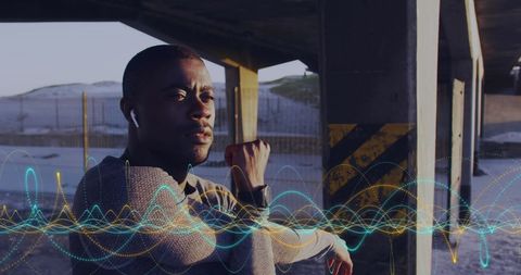 Fit Male Monitoring Fitness Progress with Smart Technology Interface