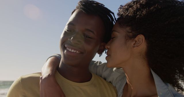 Young Couple Embracing Outdoors Enjoying Sunny Day at Beach - Download Free Stock Images Pikwizard.com