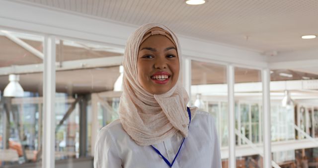 Smiling Professional Woman in Hijab at Office - Download Free Stock Images Pikwizard.com