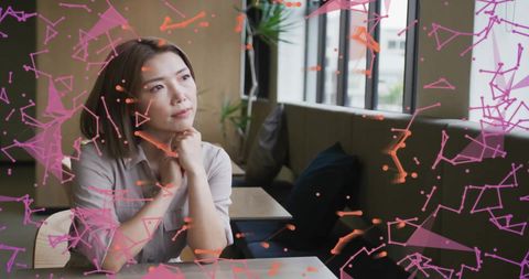 Asian Businesswoman Contemplating with Data Visualization Overlay