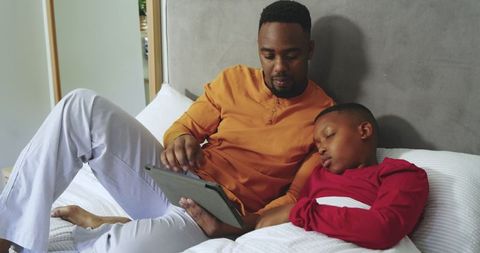 African American Father and Son Bonding with Tablet