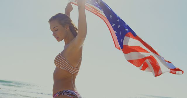 Woman Enjoying Summer Beach With American Flag - Download Free Stock Images Pikwizard.com
