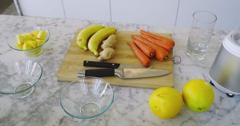 Fresh Produce on Kitchen Counter with Knife and Blender