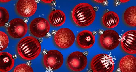 Vibrant Christmas Baubles with Falling Snowflakes on Blue Background - Download Free Stock Images Pikwizard.com