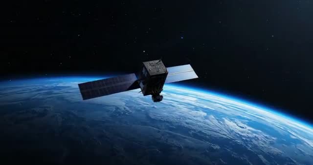 Cubic Satellite Orbiting Above Earth's Horizon at Dawn