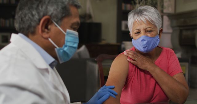 Senior Woman Receiving Vaccine from Doctor at Clinic - Download Free Stock Images Pikwizard.com