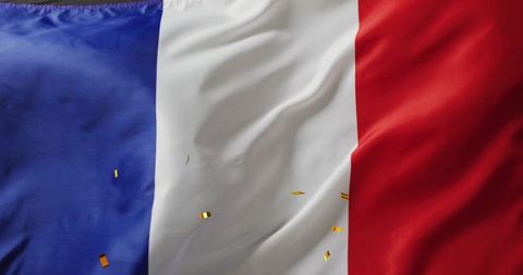 French flag with falling confetti celebrating patriotism