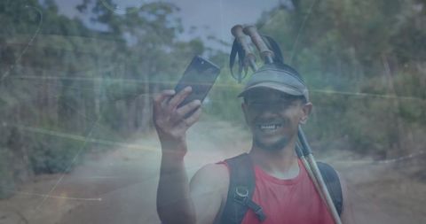 Hiker Taking Selfie on Sunlit Forest Path