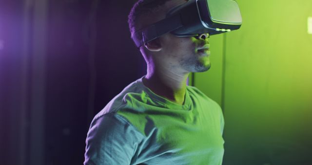 Man Experiencing Virtual Reality Through VR Headset with Flashing Lights - Download Free Stock Images Pikwizard.com