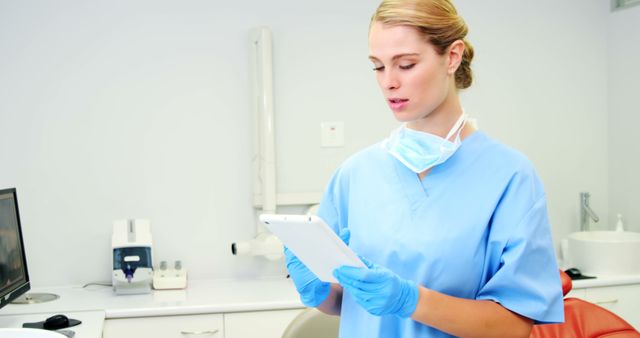 Female Medical Professional Using Tablet in Modern Clinic - Download Free Stock Images Pikwizard.com