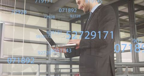 Executive typing on laptop with floating blue numeric overlays analyzing business metrics