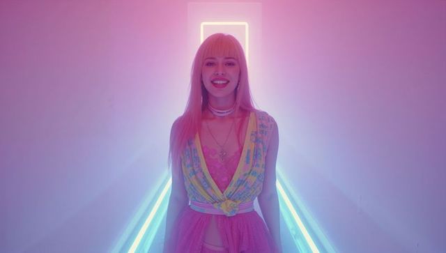 Model in Neon-Lit Corridor with Cyberpunk Fashion