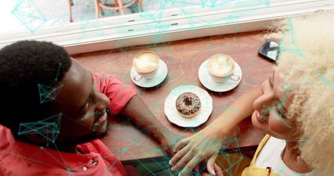 Happy Couple Enjoying Coffee Date with Latte and Donut