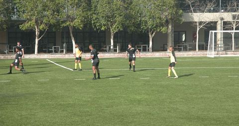 Teen Soccer Players During Intense Practice Conducting Strategic Plays