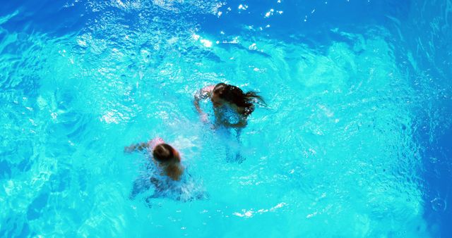 Children Playing in Bright Blue Swimming Pool From Above - Download Free Stock Images Pikwizard.com