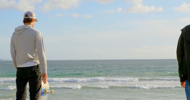 Young Men Enjoying Scenic Ocean View on Beach - Download Free Stock Images Pikwizard.com