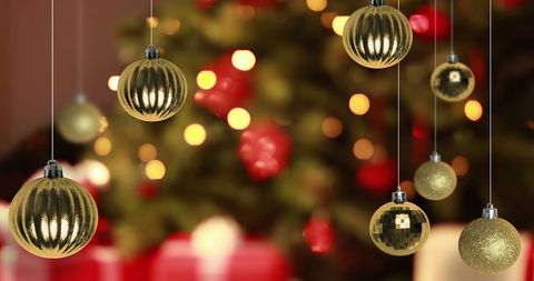 Golden Christmas Baubles on Decorated Tree with Festive Lights - Download Free Stock Images Pikwizard.com