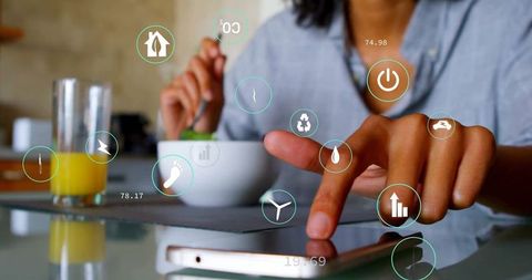 Woman Using Digital Tablet in Smart Home Kitchen Environment