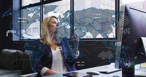 Businesswoman analyzing global data with holographic world map overlay in modern office