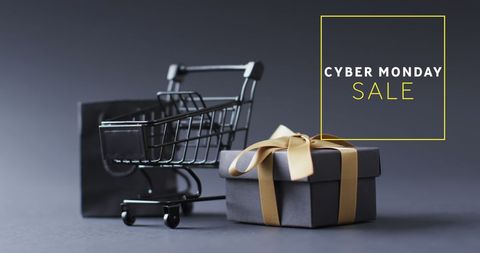 Cyber monday sale display featuring shopping cart and gift boxes