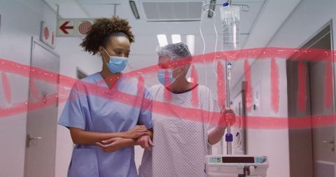 Nurse guiding senior patient with iv pole through hospital corridor, masked, red brush overlay