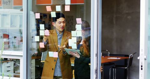 Business Professionals Collaborating with Sticky Notes