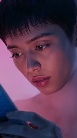 Short-Haired Woman Holding Smartphone, Studying Screen in Moody Gradient Fog Vertical Video
