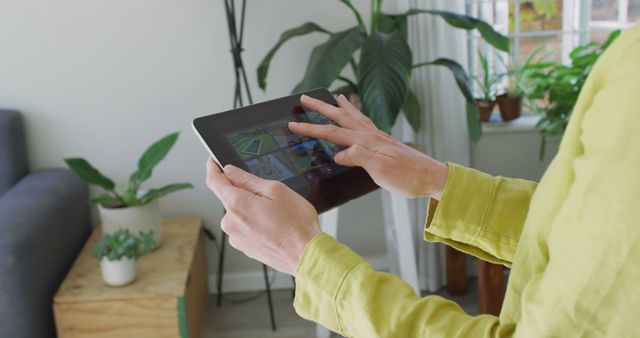 Close-up of person using tablet with home automation app indoors - Download Free Stock Images Pikwizard.com