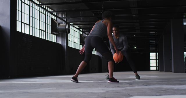 Dynamic Female Athletes Practicing Basketball in Industrial Space - Download Free Stock Images Pikwizard.com