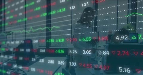 Professional Woman Analyzing Stock Market Data in Modern Office Environment