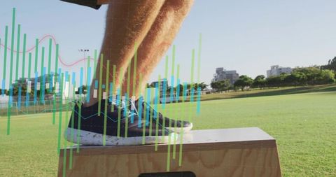 Athlete stepping onto plyo box wearing blue-laced sneakers with performance data overlay on grass