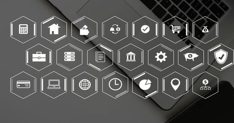 Digital business icons overlay on laptop keyboard