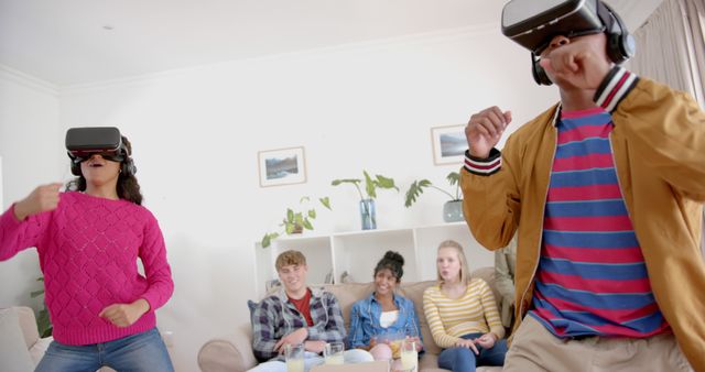 Teenagers Enjoying Virtual Reality Games in Living Room Setting - Download Free Stock Images Pikwizard.com