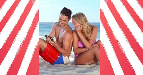 Happy Young Couple Relaxing on a Beach in Summer