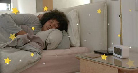 Cuddling same-sex couple embracing in cozy pastel bed with bedside clock and stars overlay