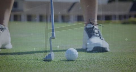 Golfer lining up putt on green with digital grid overlay for precision training