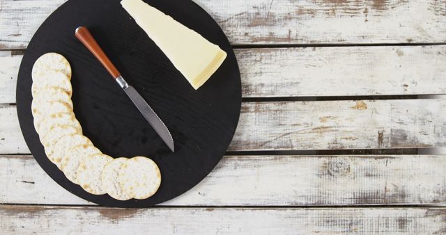 Round Cutting Board with Cheese and Crackers on Rustic Wooden Table - Download Free Stock Images Pikwizard.com