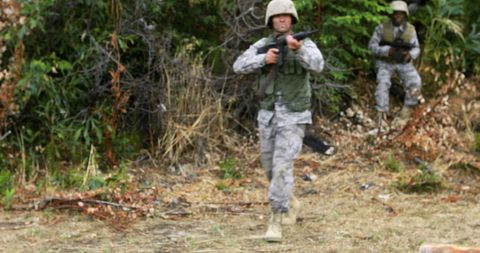 Soldiers in Camouflage Engaging in Outdoor Training - Download Free Stock Images Pikwizard.com