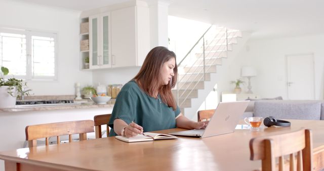 Woman Working at Dining Table in Modern Home Interior - Download Free Stock Images Pikwizard.com