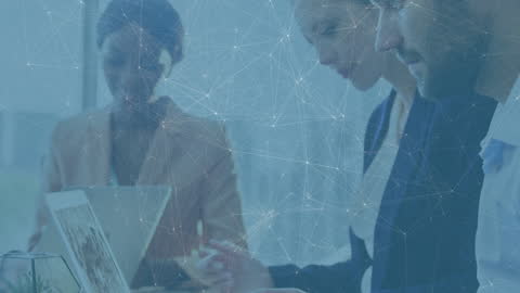 Diverse Business Team Connected Through Digital Network in Office