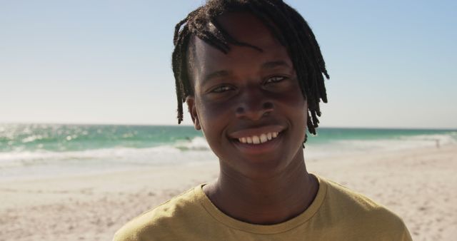 Smiling Teenage Boy on Sunny Beach Day - Download Free Stock Images Pikwizard.com